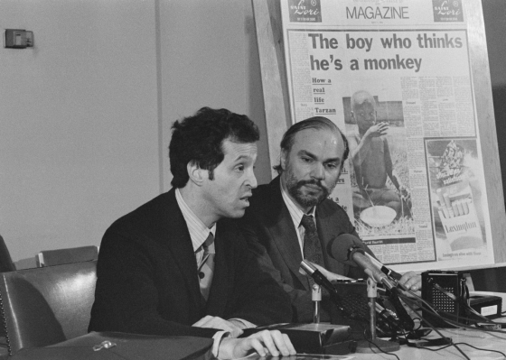 May 1976: Harlan Lane, left, and Richard Pillard, right, tell a Boston news conference of their plans to travel to Burundi to study a boy reportedly found living with monkeys. An enlargement of the newspaper article that called their attention to the case is in the background. Two years later, they published their book The Wild Boy of Burundi. (picture-alliance/AP Images) May 1976: Harlan Lane, left, and Richard Pillard, right, tell a Boston news conference of their plans to travel to Burundi to study a boy reportedly found living with monkeys. An enlargement of the newspaper article that called their attention to the case is in the background. Two years later, they published their book The Wild Boy of Burundi. (picture-alliance/AP Images)